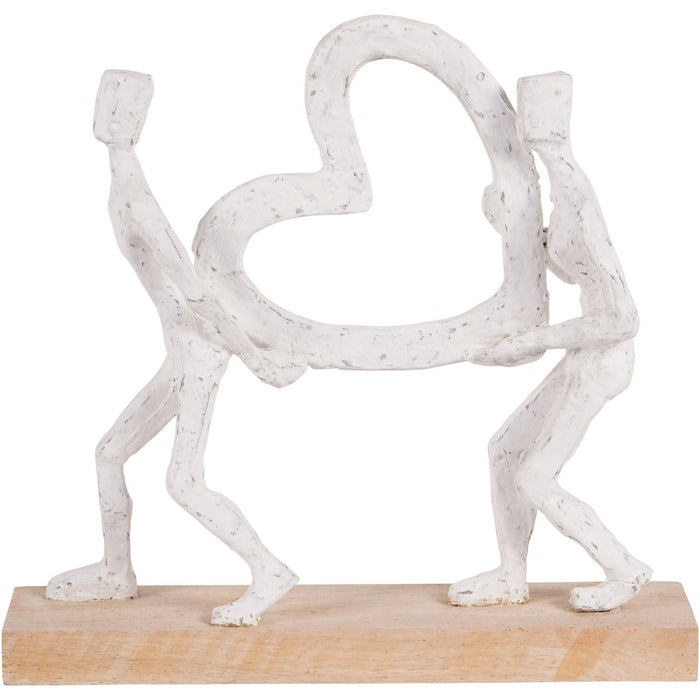 White Sculpture Of A Couple Holding A Heart