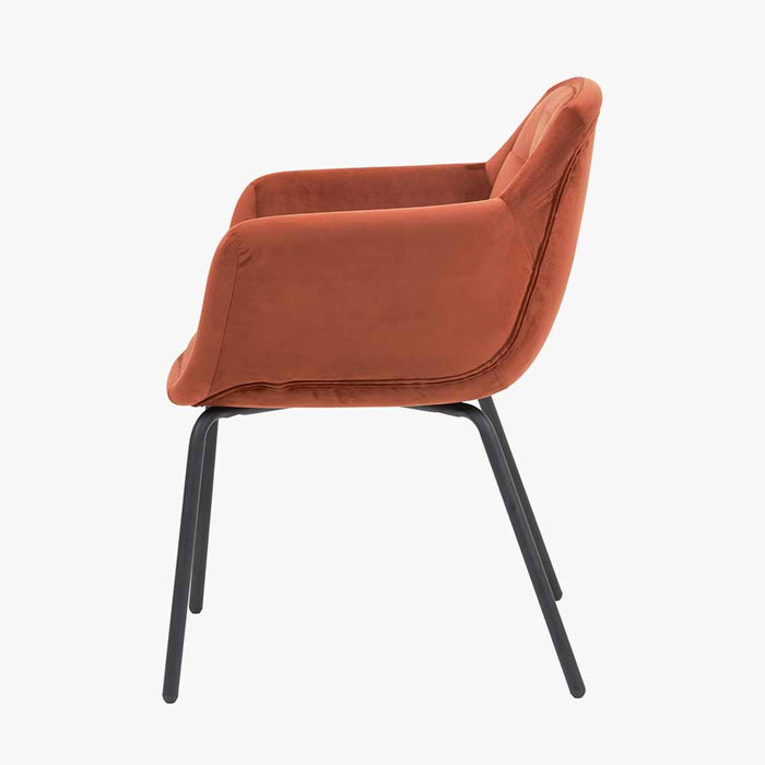Milan Carver Dining Chair In Burnt Orange Velvet & Black Metal Legs