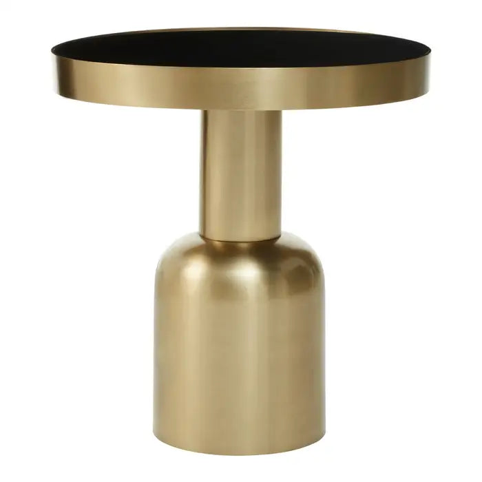 a gold table with a black top